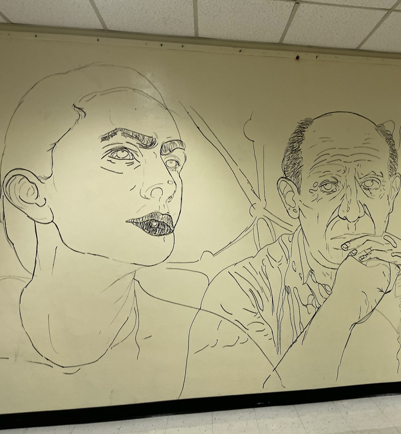 Western High School art students painting the Wall of Artists mural