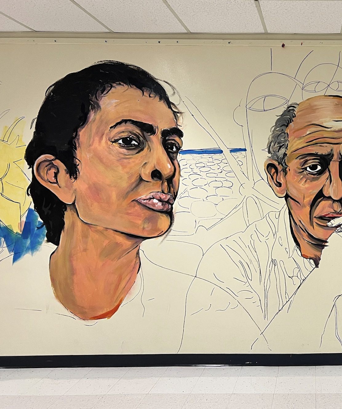 Western High School art students painting the Wall of Artists mural