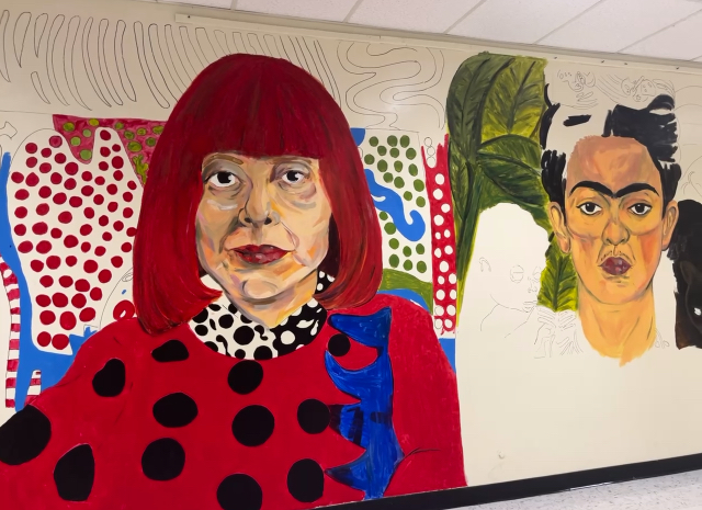 Western High School art students painting the Wall of Artists mural