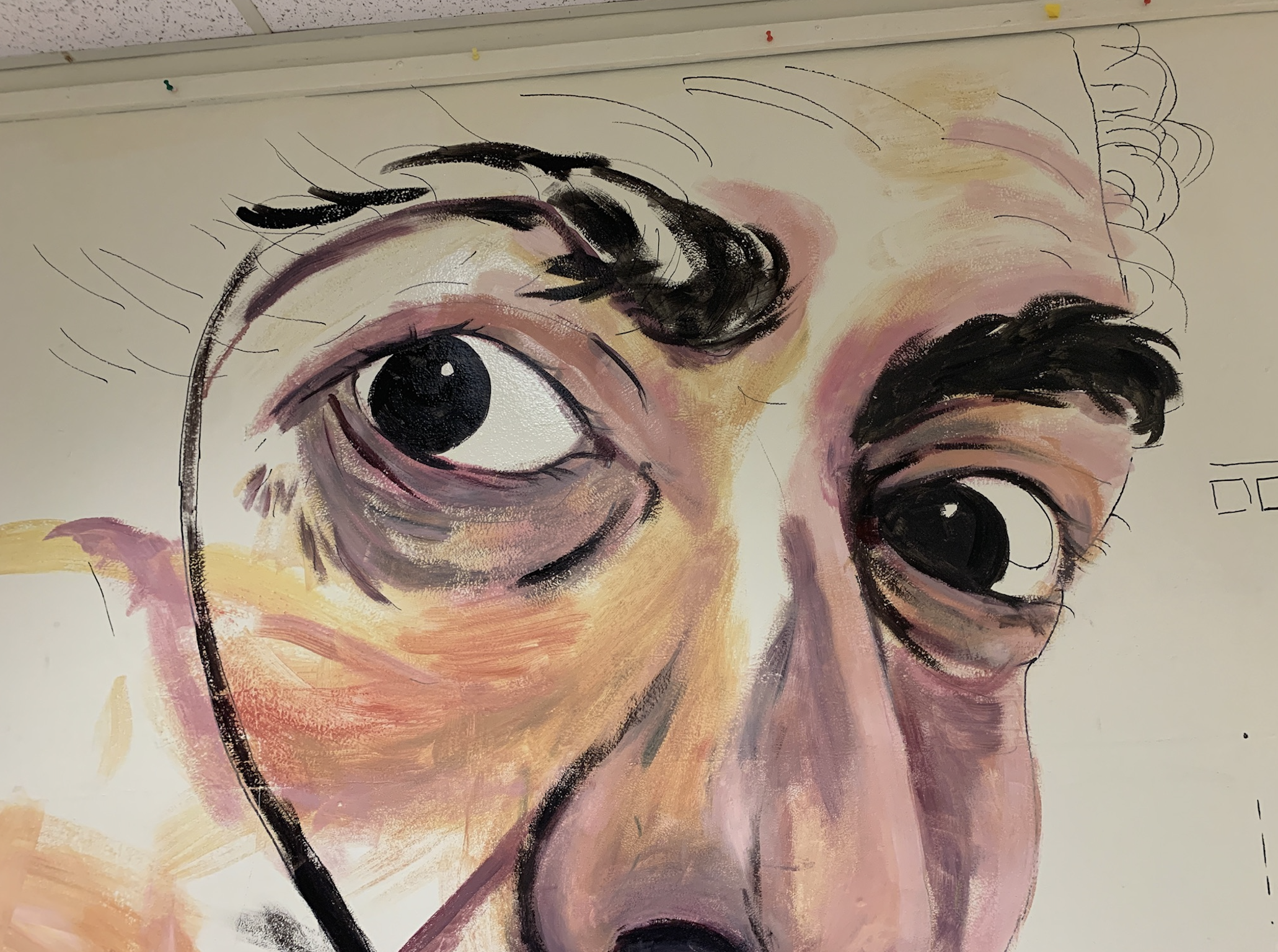 Western High School art students painting the Wall of Artists mural